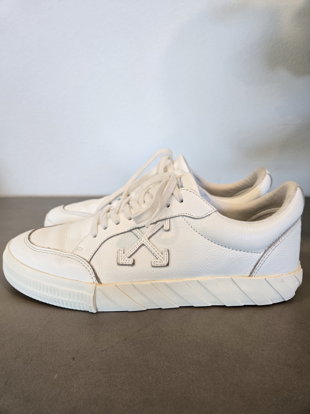 Off-White Vulc Low sneakers featuring a signature marbled black and white sole